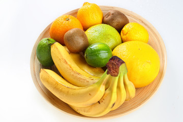 Fresh fruit on wooden plate