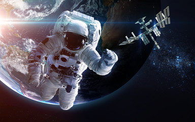 Naklejka na ściany i meble Astronaut in outer space. Spacewalk. Elements of this image furnished by NASA