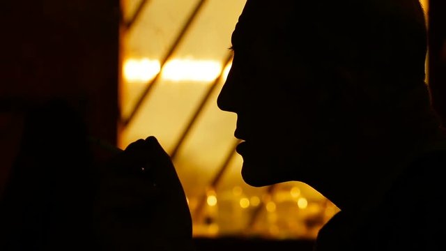 Silhouette of male smokers