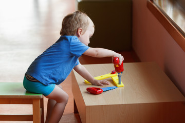 kid child boy playing with toys