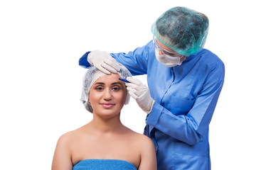 Young woman preparing for plastic surgery isolated on white