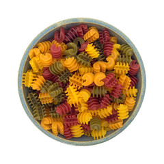 Corn vegetable radiatore pasta in a bowl top view on a white background.