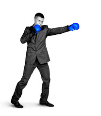 Serious businessman in sports boxing stance