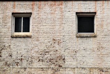Old brick wall with windows exterior