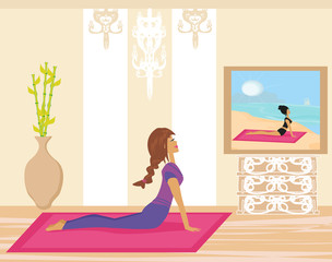 Obraz na płótnie Canvas Young woman practicing yoga indoors