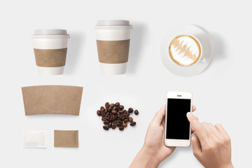 Design concept of mockup using smartphone and coffee set 