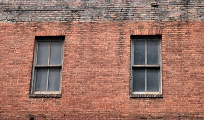 Old brick wall background with windows