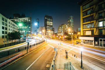 Fototapeta na wymiar View of an intersection in SoHo at night, in Manhattan, New York