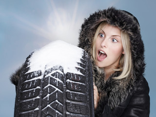 Woman with winter tyre