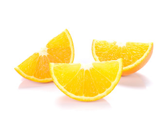 Orange cut pieces on white background.