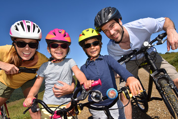 Portrait of happy family on a biking day