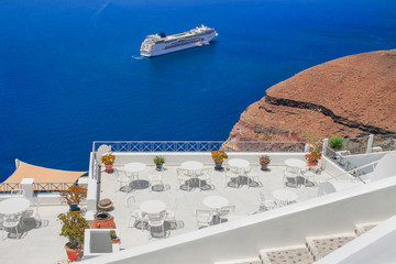 A view to enjoy - Cafe terrace with beautiful sea view on Santorini island, Greece.
