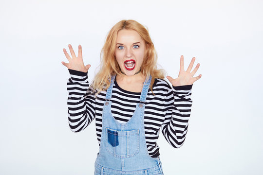 girl acting like cat on white backgound