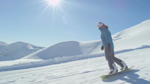 SLOW MOTION: Snowboarding in ski resort