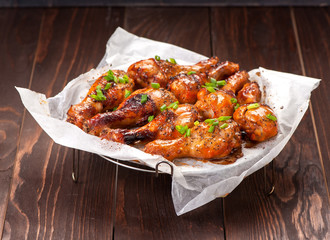 Grilled chicken legs with spicy sauce