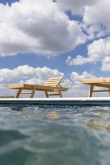 Amazing views over the pool area with wooden sun loungers.
