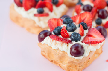 Pavlova Cake with cream, blueberries and strawberries