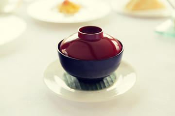 ceramic pot with hot dish on restaurant table