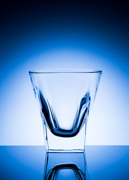 Beautiful transparent glass on a blue background
