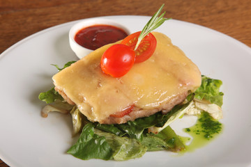 meat with cheese on lettuce