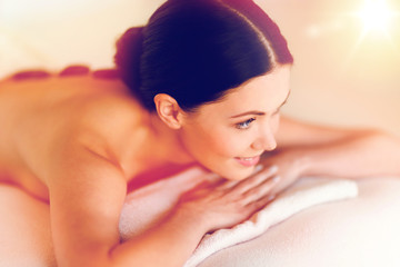 Obraz na płótnie Canvas woman in spa with hot stones
