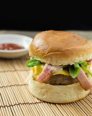 Hamburger with pork, bacon, cheese