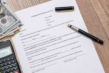 contract form for purchase car with pen and money