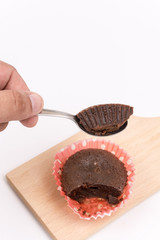 Slice of chocolate muffin on the spoon
