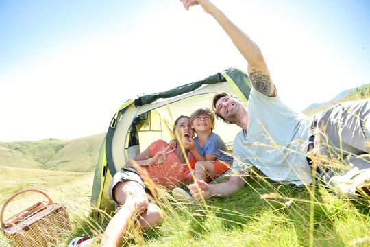 Family Taking Selfie Picture While Camping