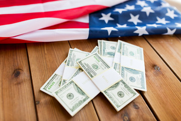 Fototapeta na wymiar close up of american flag and dollar cash money