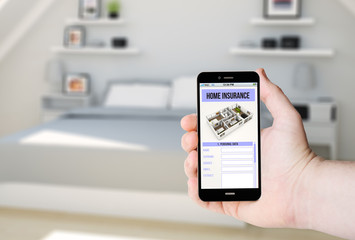 Hand hold a phone with home insurance on a screen