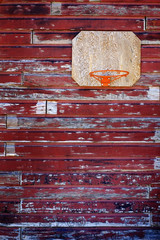 Old Basketball Hoop on Red Barn Wall
