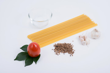 Raw Spaghetti and salt on wood board - Close up.