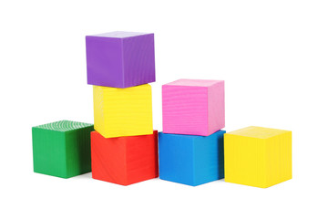 Colorful wooden toy cubes isolated on a white