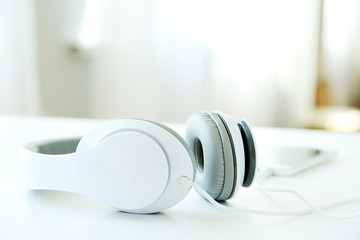 Headphones on a white table, close up