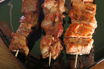 skewer on a black plate