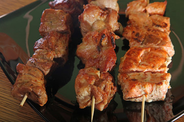 skewer on a black plate