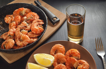 Dish with fried shrimps and lemon