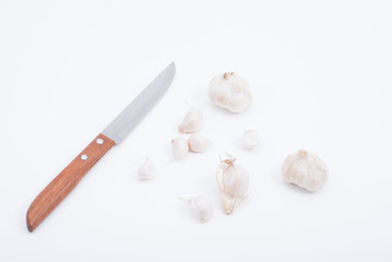 Garlic and knife white background.