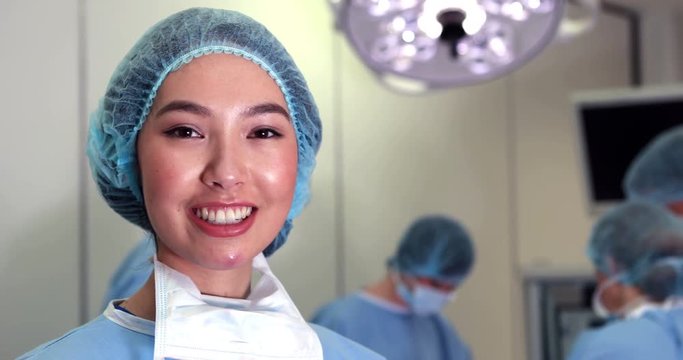 Surgical student smiling at camera in high quality 4k format