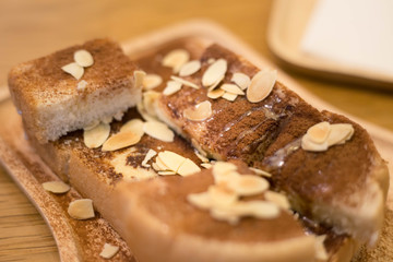 toast with chocolate powder with wood background