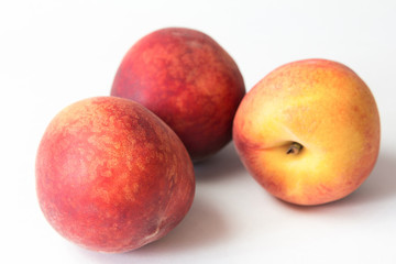 Ripe juicy peach isolated on white