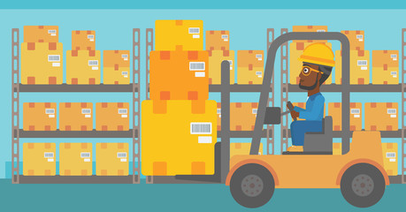 Warehouse worker moving load by forklift truck.