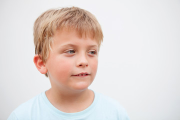 Fototapeta premium Funny blond boy looking at camera