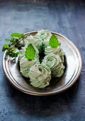 Marshmallow on the tray decorated by mint.