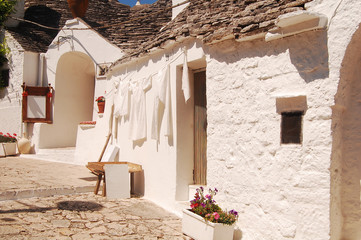 A characteristic square of Alberobello with its famous Trulli -