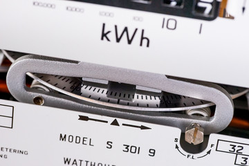 Kilowatt electric meter dial close-up. Concept for price rise, higher costs, fuel and energy bills.