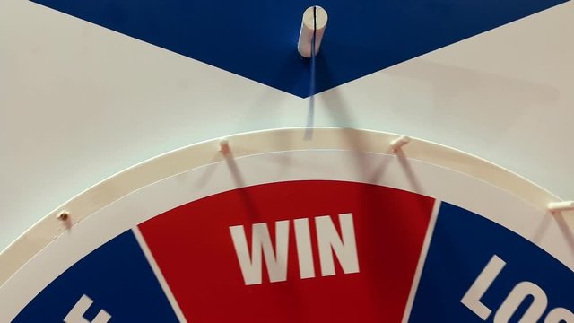 Big red blue fortune wheel spinning and stops at Win