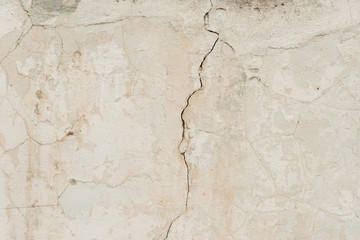 Wall fragment with scratches and cracks