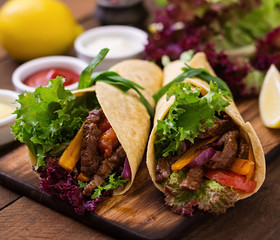 Mexican fajitas for beef and grilled vegetables (paprika, red onion, tomato).